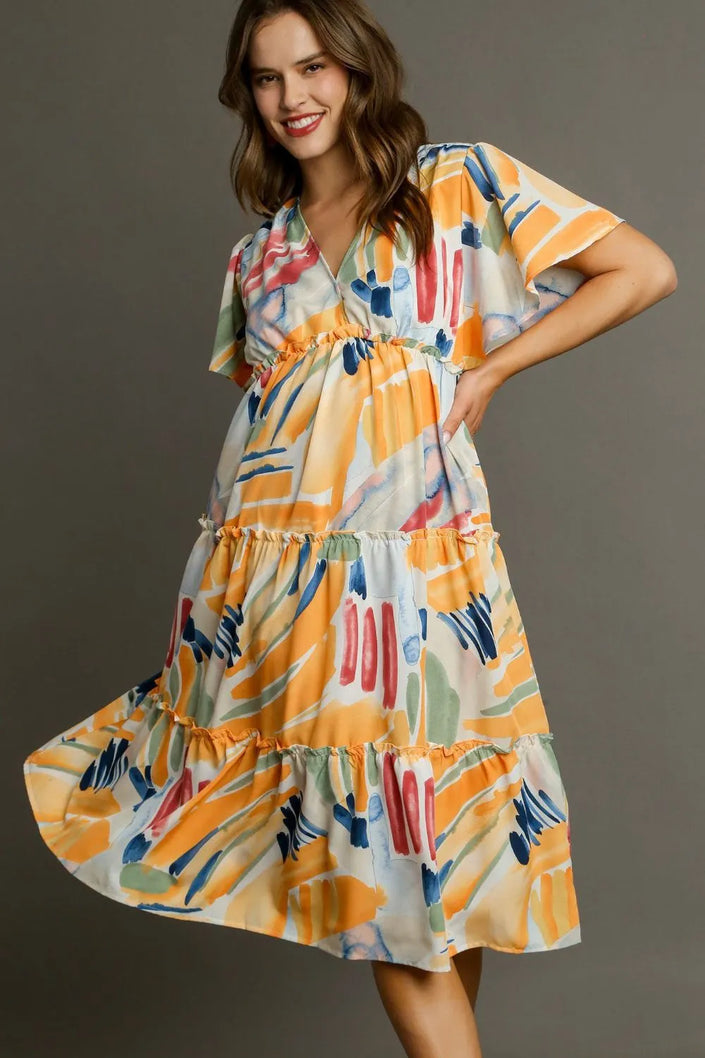 Vibrant abstract print flutter sleeve tiered midi dress with ruffled hem and elastic waist