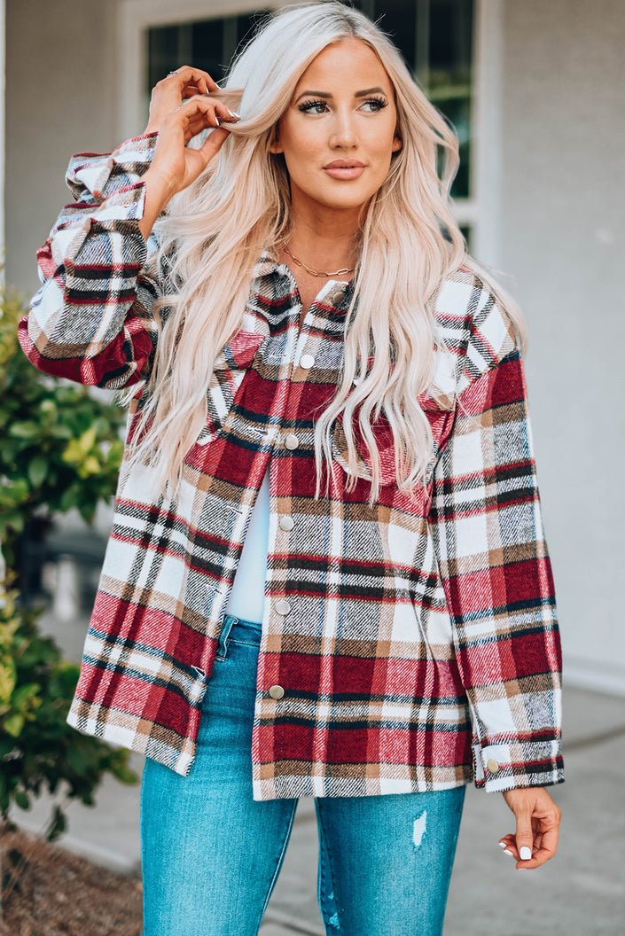 Plaid shirt jacket styled open with visible buttons and relaxed fit silhouette