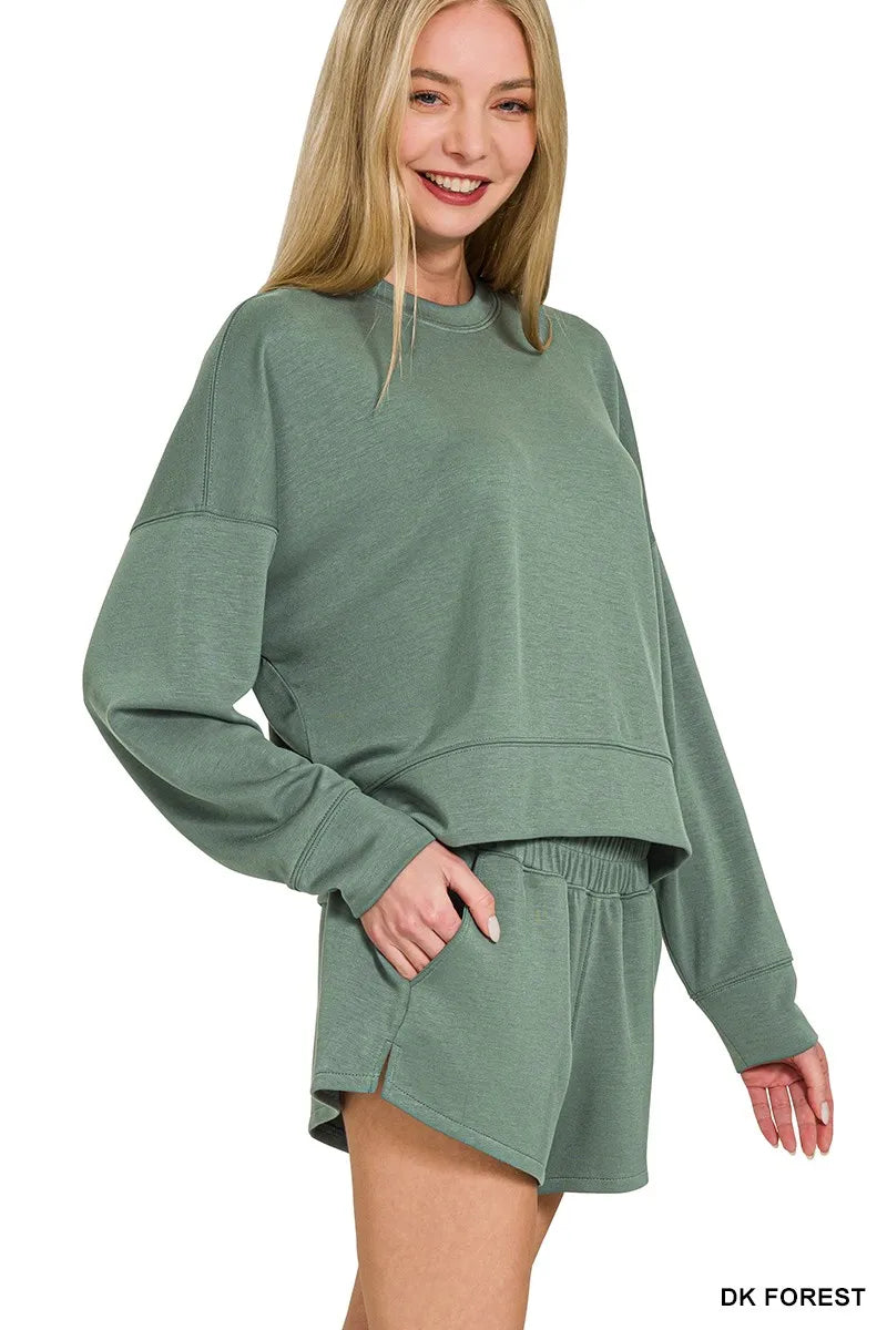 Two-piece scuba set showcasing sleek long-sleeve sweatshirt and shorts