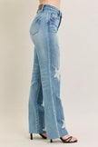 High-waisted 90s-style rigid distressed denim jeans, plus size, with faded blue washes and intentional frayed details.