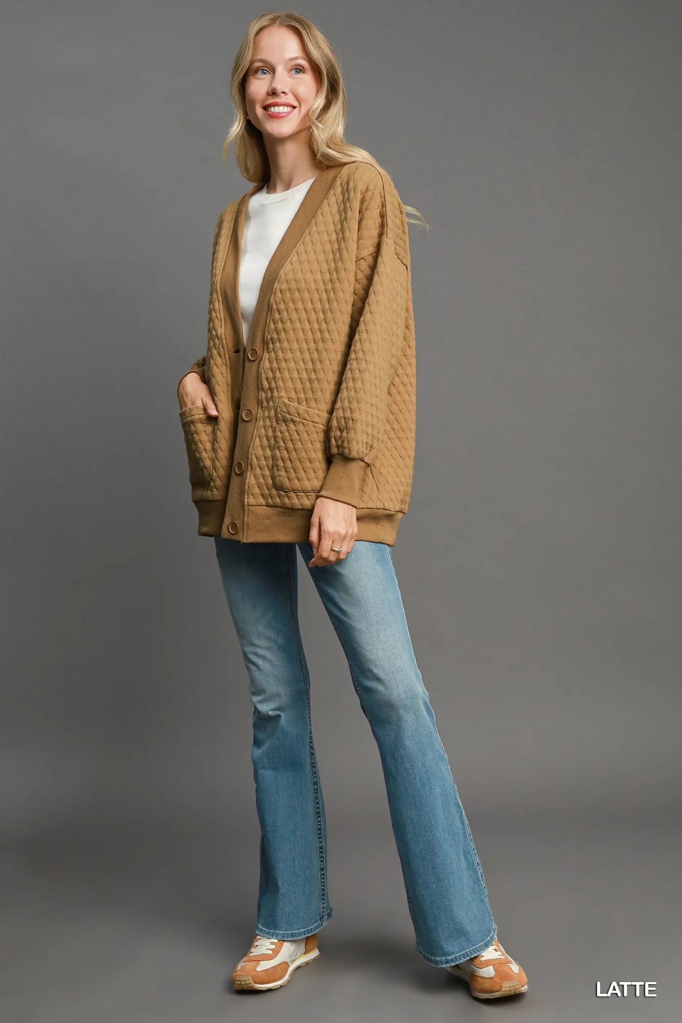 Close-up of button-front detail on textured Jacquard cardigan in latte beige