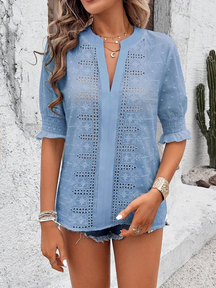 white blouse with intricate eyelet pattern and casual flowing fit