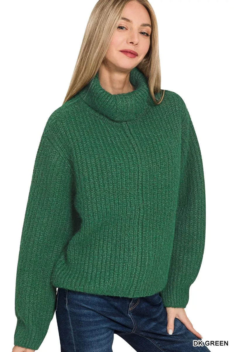 Close-up of ribbed knit high-neck zip cardigan in deep green
