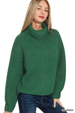 Close-up of ribbed knit high-neck zip cardigan in deep green