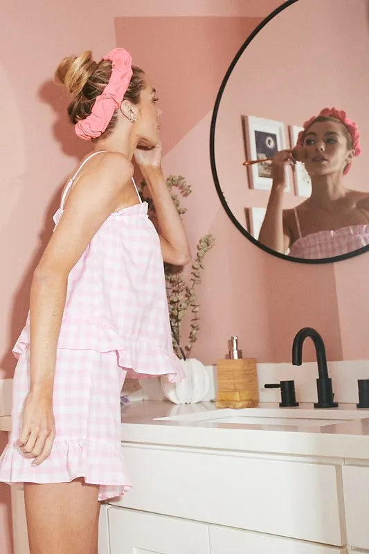 Blush pink gingham pajama set featuring ruffle details