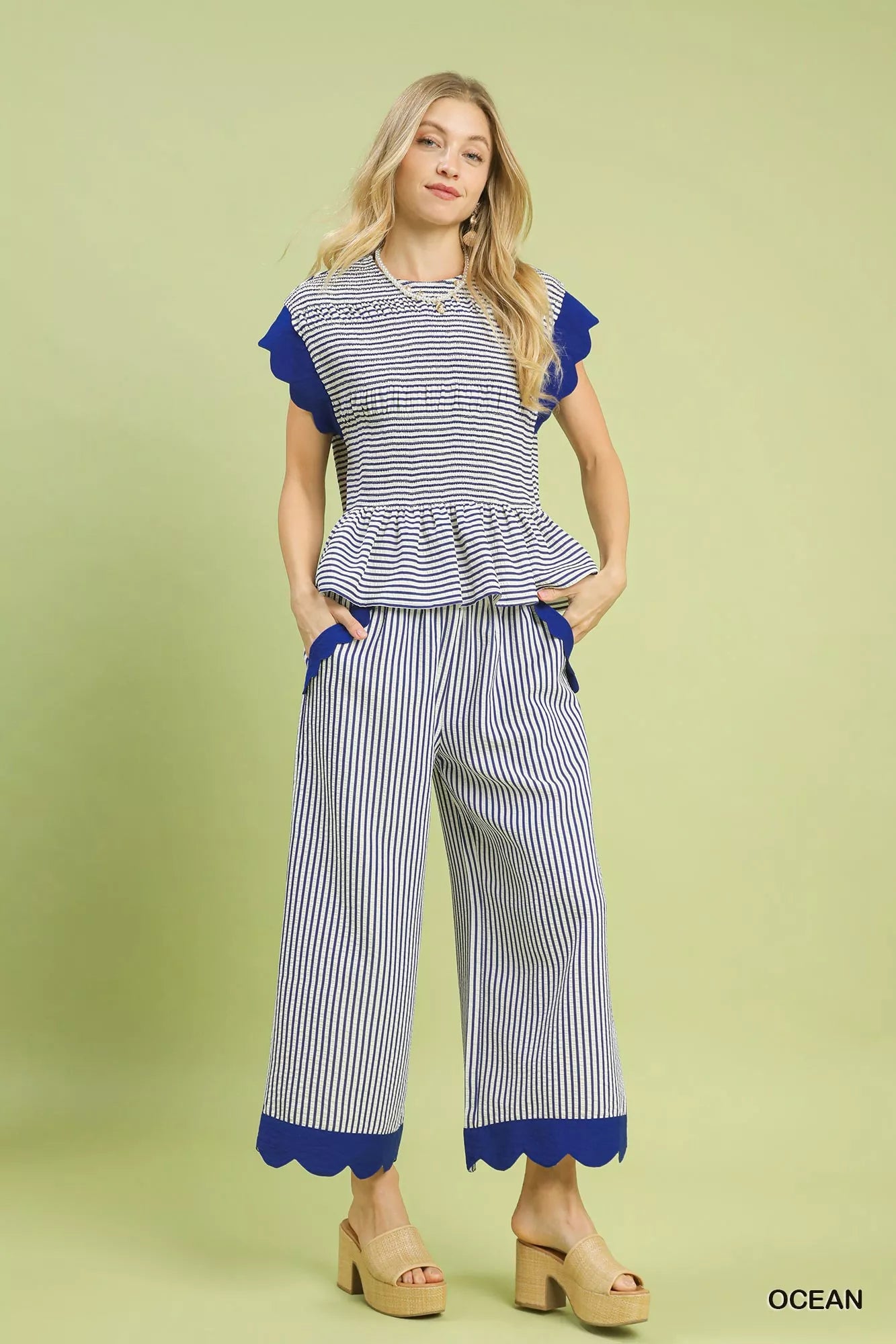 Ocean blue pants with ruffled pocket trim and elastic waist