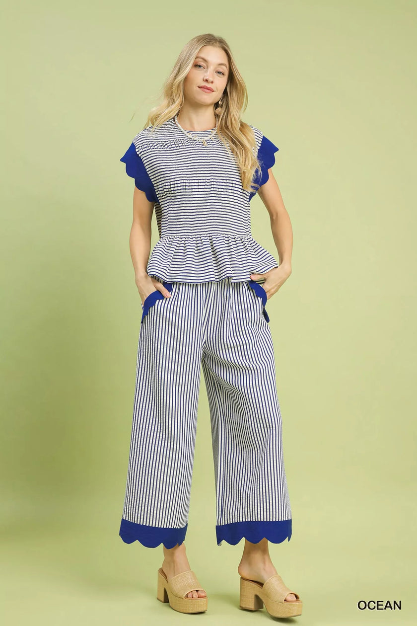Ocean blue pants with ruffled pocket trim and elastic waist