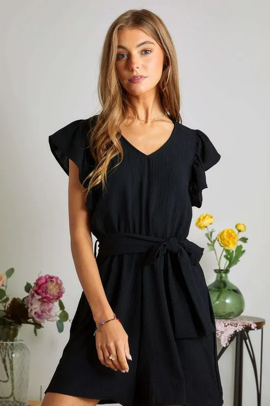 Charcoal black romper with ruffle sleeves and front pockets