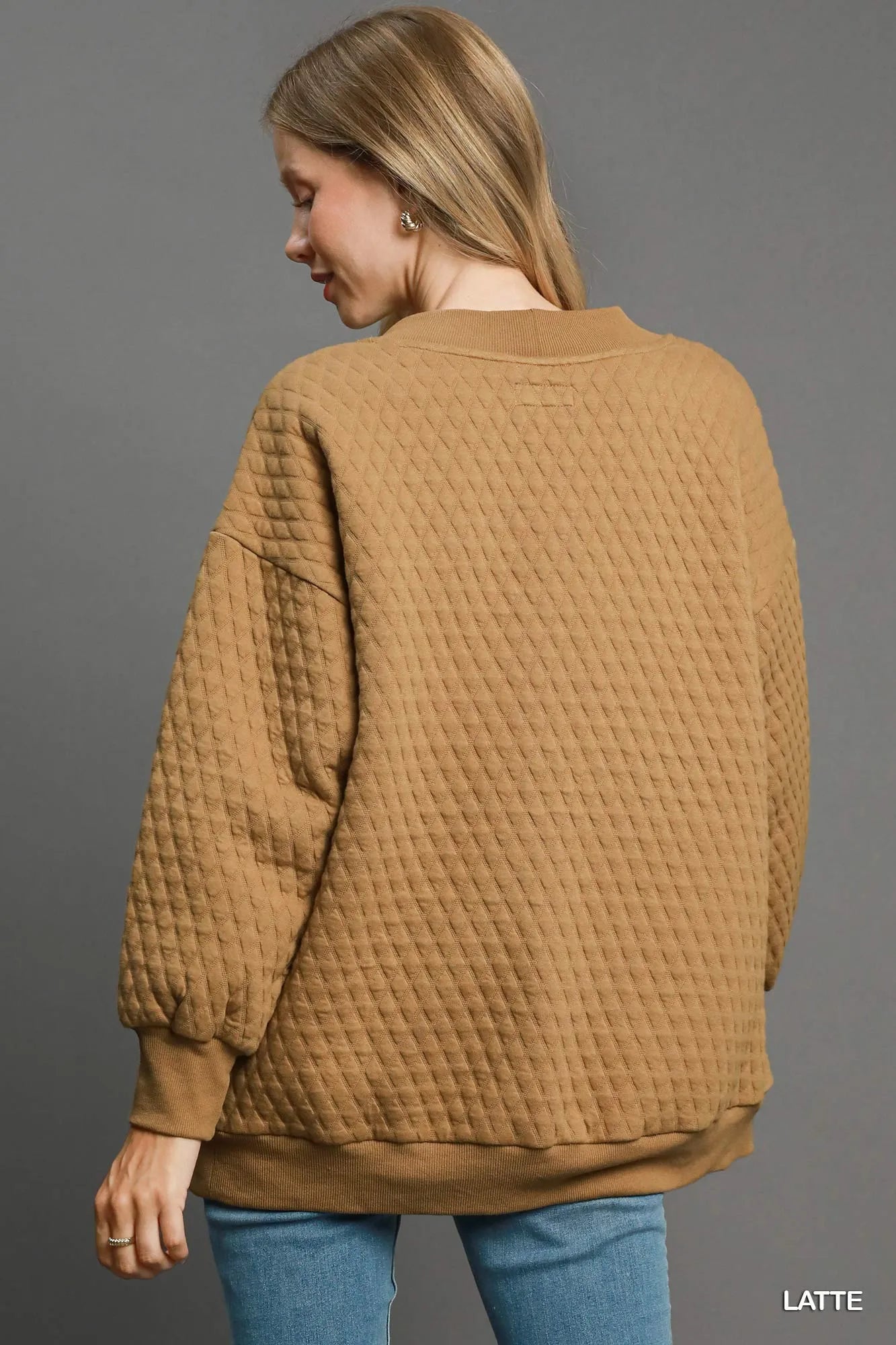Textured cable knit detail on latte beige Jacquard cardigan front