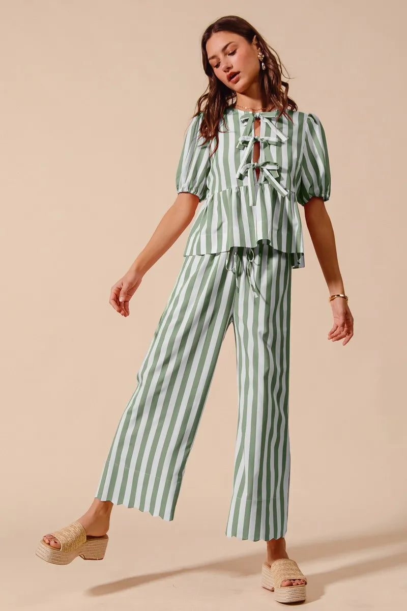 Sage green striped puff-sleeve top paired with wide-leg pants