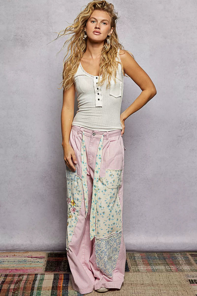 Buttoned front closure on feminine lace-trimmed tank top