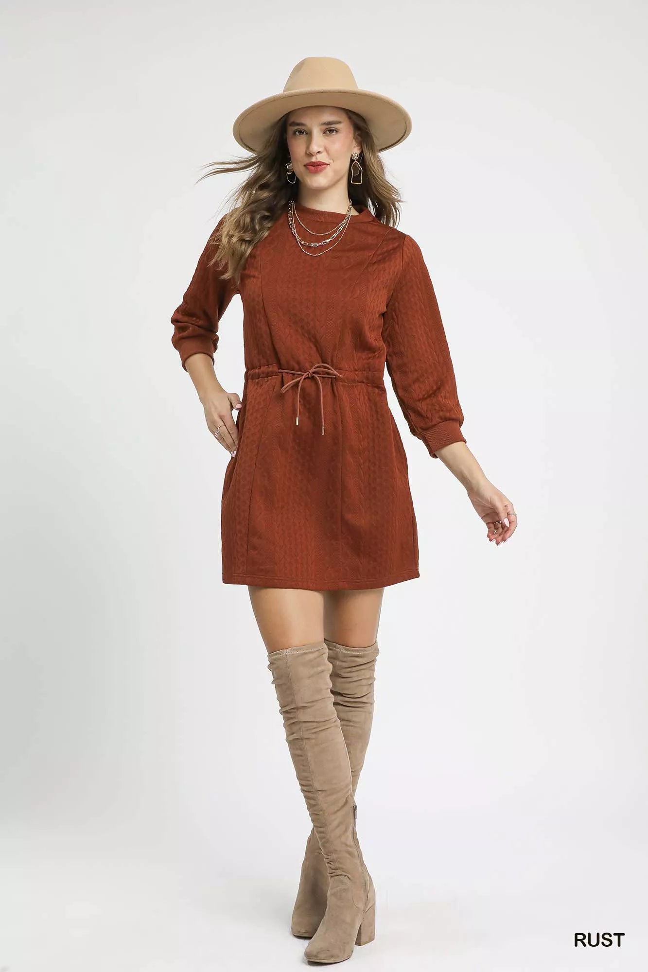 Front view of rust orange mini dress with functional front pockets