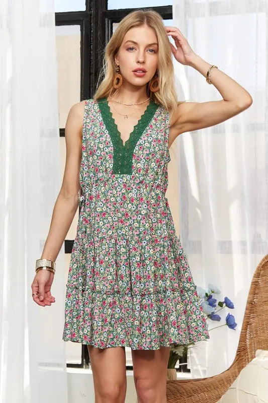 Close-up of delicate lace trim on V-neck mini dress