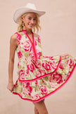 Front view of coral pink floral mini dress with tiered ruffles