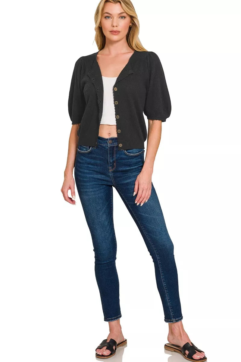 Black wool cardigan with puff sleeves shown from side