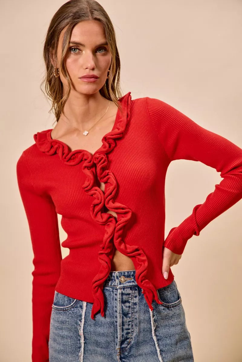 Red ribbed sweater with cascading ruffles, fitted cut, denim pair