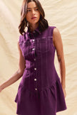 Close-up of ruffled detail on sleeveless orchid purple mini dress