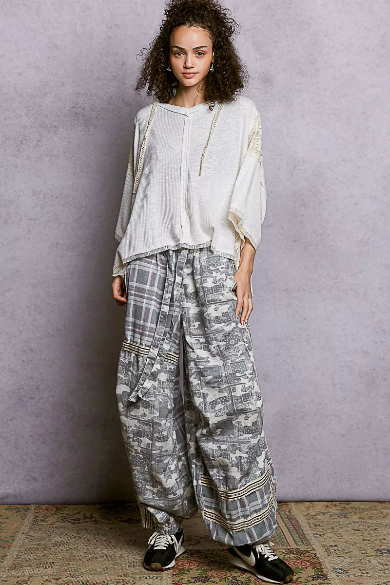 Airy hoodie top with exposed seams and relaxed fit