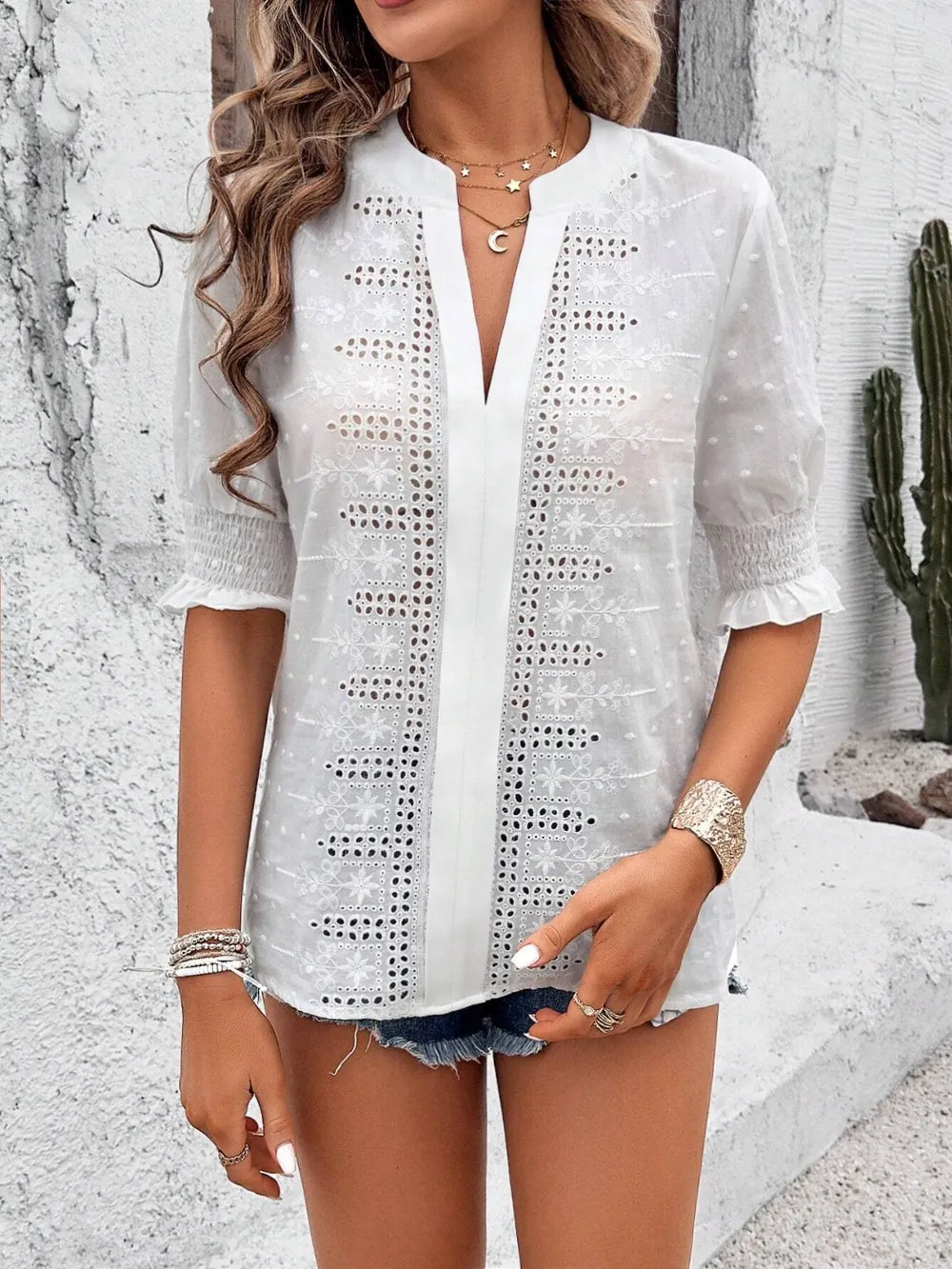 white blouse with airy semi-sheer fabric and delicate eyelet embroidery
