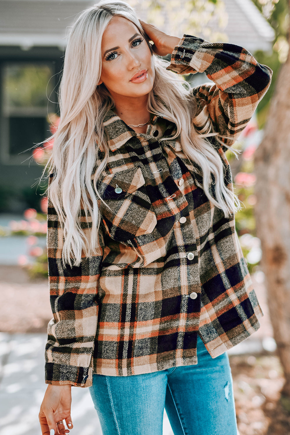 Plaid shirt jacket layered over shirt, showing relaxed fit and buttoned front
