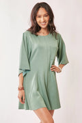 Seafoam green draped sleeve romper with tied waist and wide kimono sleeves