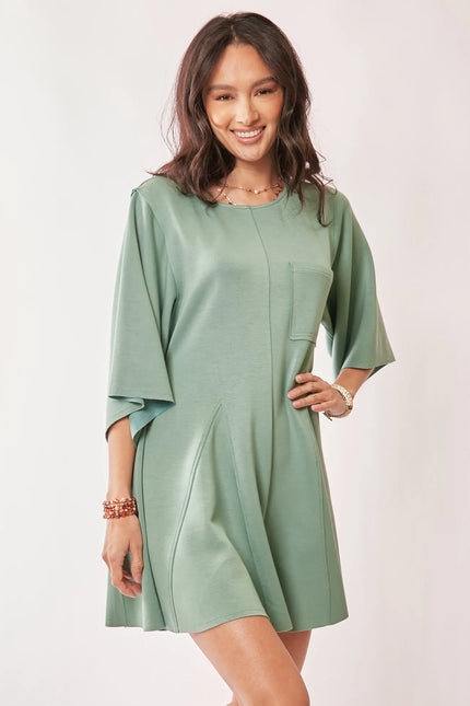 Seafoam green draped sleeve romper with tied waist and wide kimono sleeves