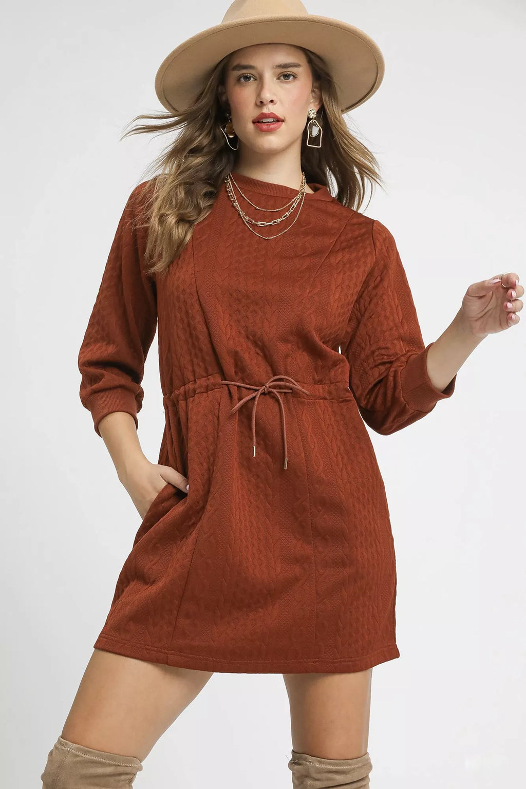 Rust orange cable-knit mini dress with drawstring waist and front pockets