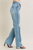 High-waisted rigid distressed denim jeans, 90s straight fit, light blue with strategic rips, plus size.