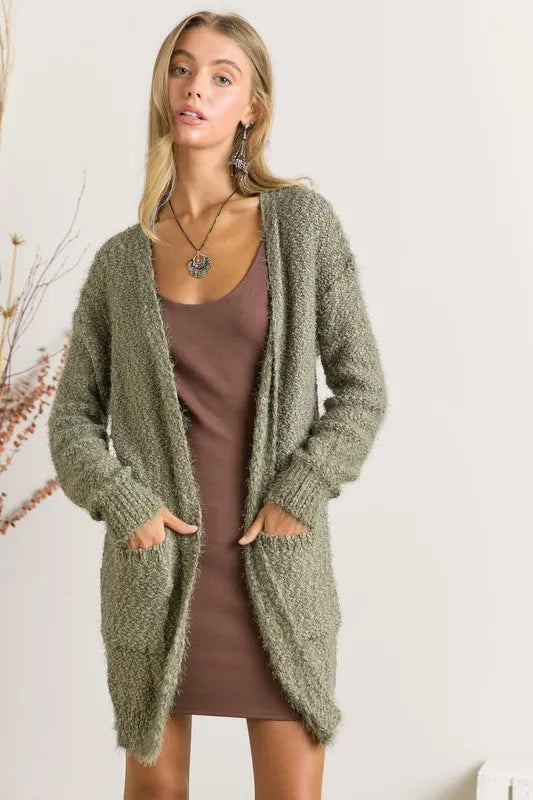 Olive green fuzzy cardigan with pocket detail and soft texture