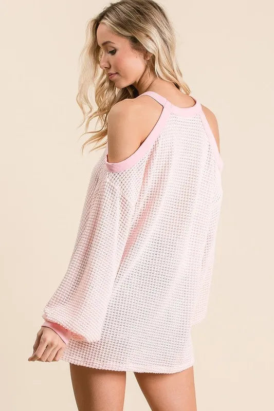 Breathable textured white popcorn waffle top with cold shoulder cutouts and pink accents, relaxed fit for casual trendy style.